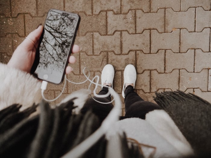 A person listening to a podcast on their phone